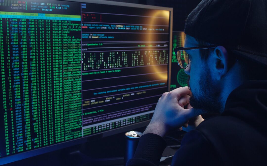 Free A Man Looking at a Computer Screen with Data Stock Photo